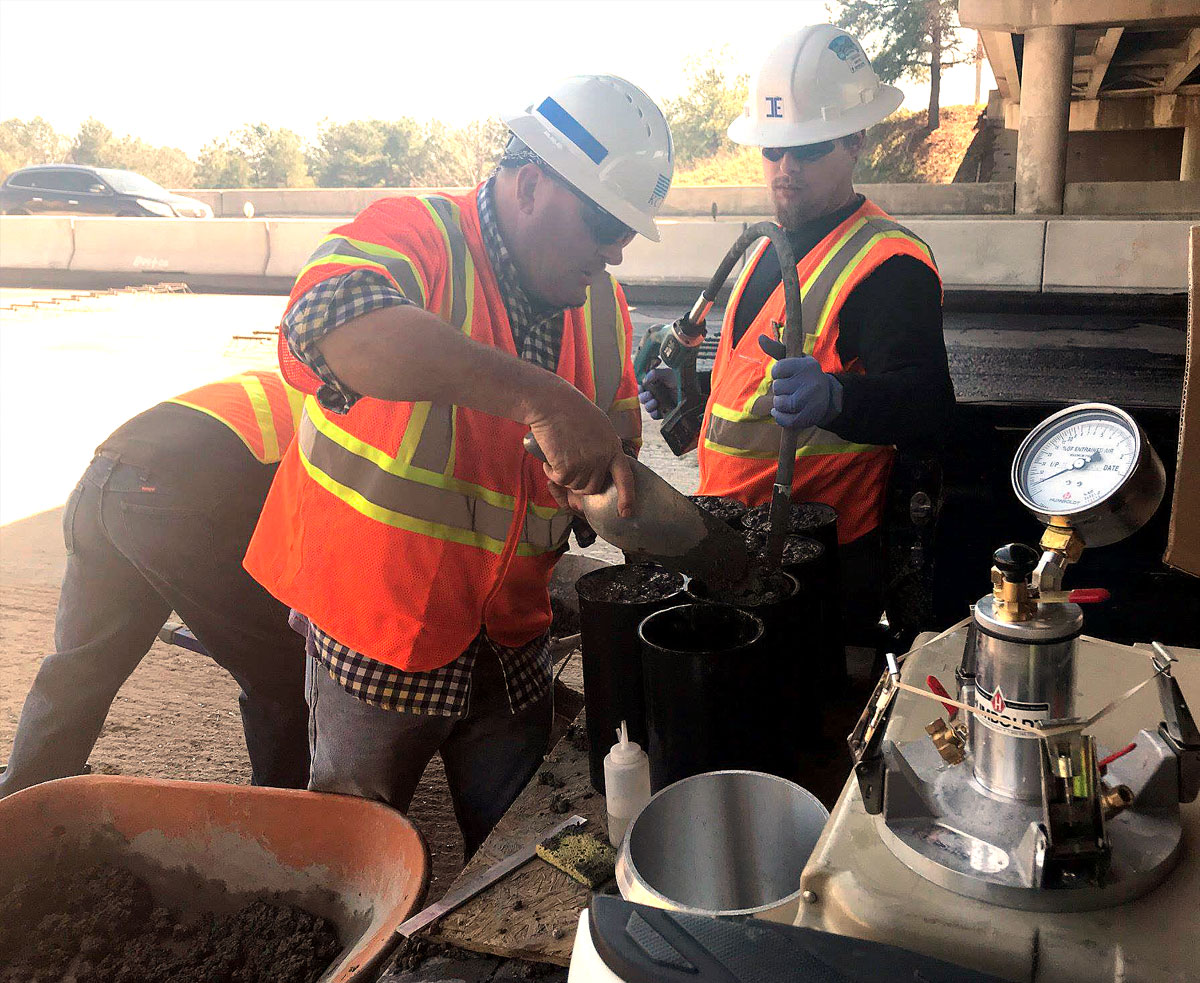 Photo of Inspectors from KCI and ICE testing the Concrete Pavement for SCDOT