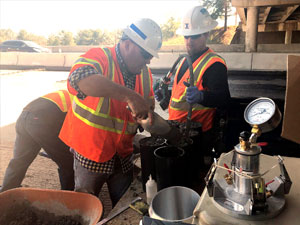 Men mixing concrete