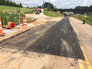 work crew paving an interstate road