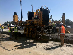 Photo of men paving a lane on the interstate